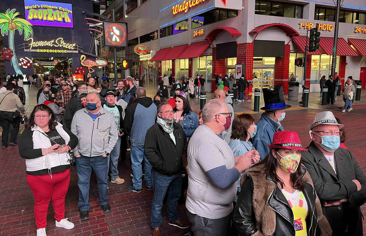 A large crowd gathers on 4th Street to get into Fremont Street Experience for the New Year&#x20 ...