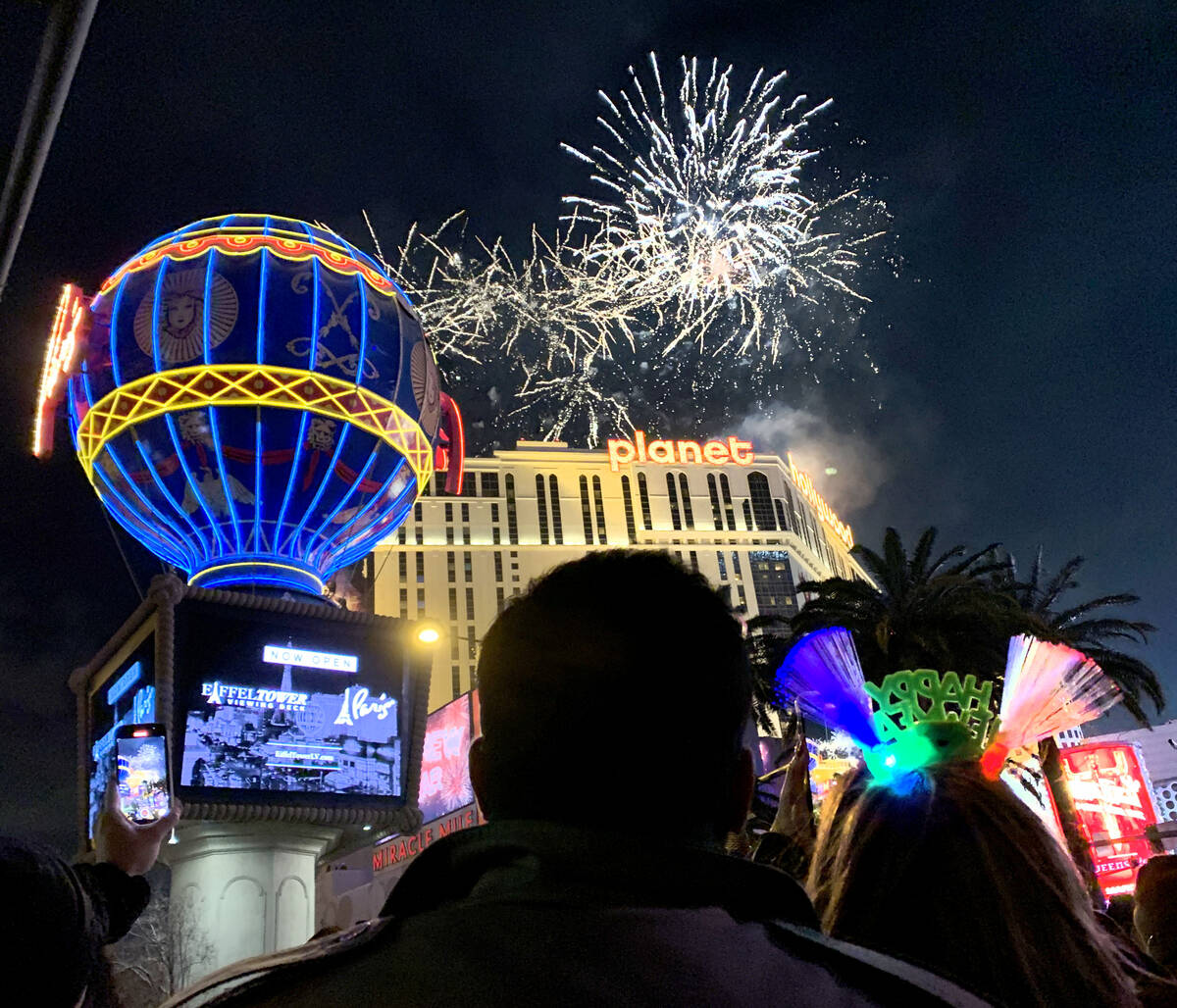 Fireworks explode over the Las Vegas Strip during New Year's celebrations, Friday, Dec. 31, 202 ...