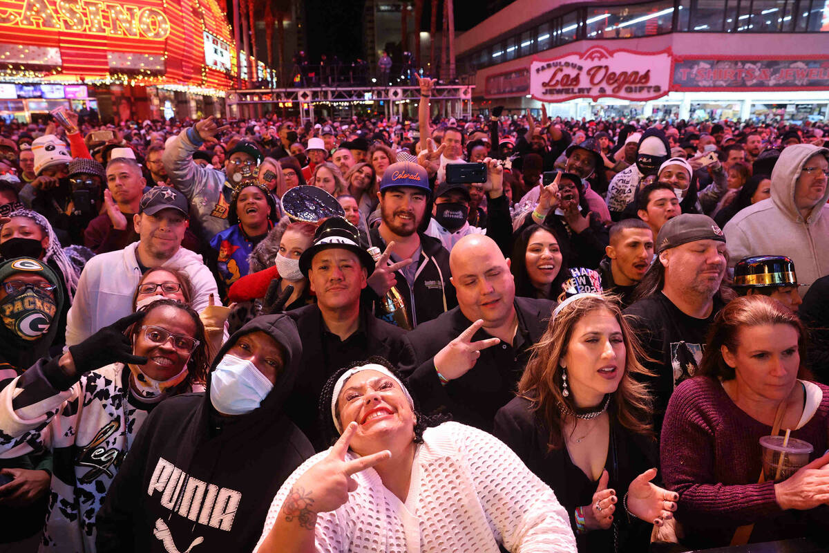 Fans react during a Bobby Brown performance on New Yearճ Eve at the Fremont Street Experi ...