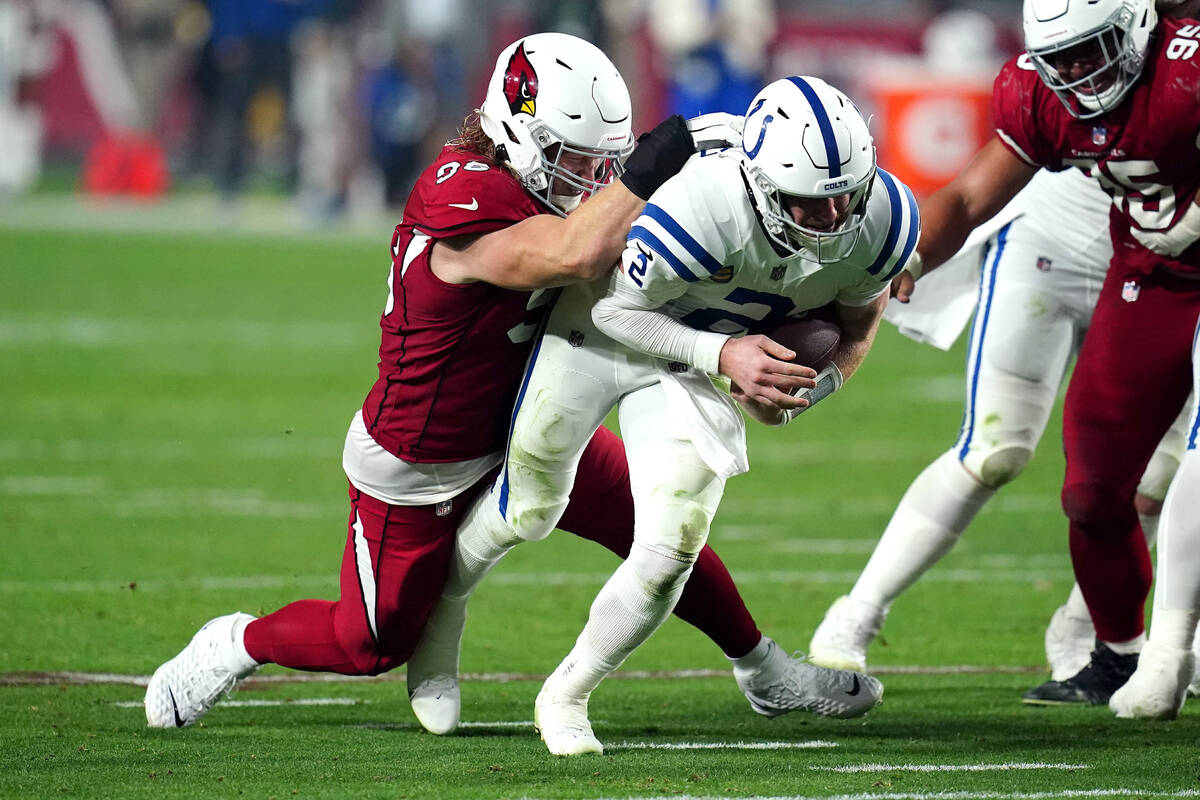Arizona Cardinals defensive lineman Josh Mauro tackles Indianapolis Colts quarterback Carson We ...