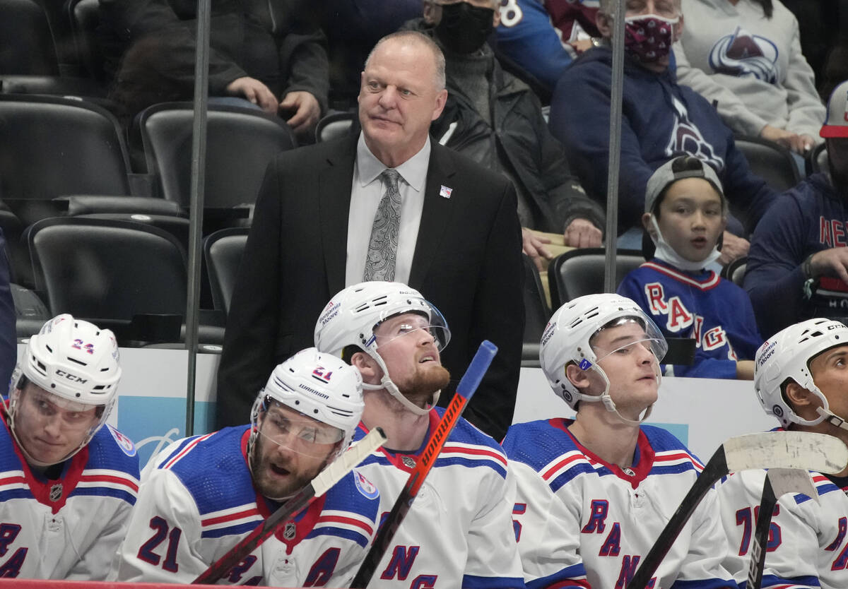 New York Rangers head coach Gerard,r ear, Gallant looks on during the second period of an NHL h ...