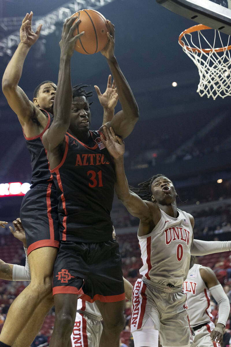 San Diego State Aztecs forward Nathan Mensah (31) shoots against UNLV Rebels forward Victor Iwu ...
