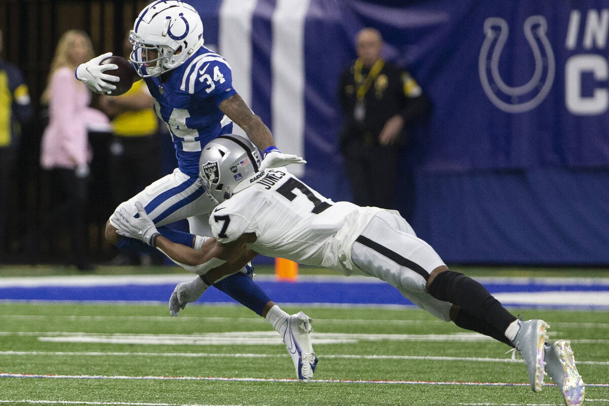 Indianapolis Colts cornerback Isaiah Rodgers (34) runs back an interception as Raiders wide rec ...