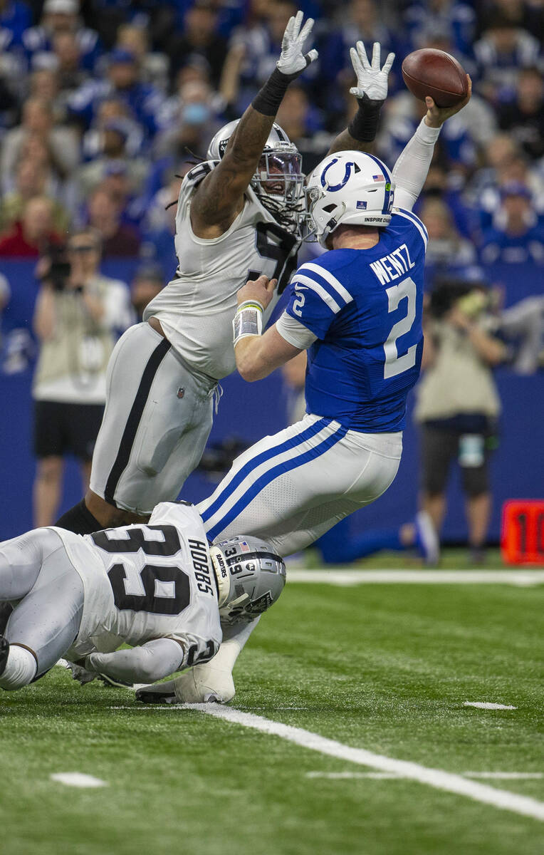 Raiders defensive tackle Darius Philon (96) pressures Indianapolis Colts quarterback Carson Wen ...