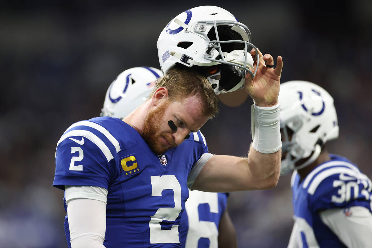 Indianapolis Colts backmost   Carson Wentz (2) walks disconnected  the tract  aft  an incomplete walk  du ...