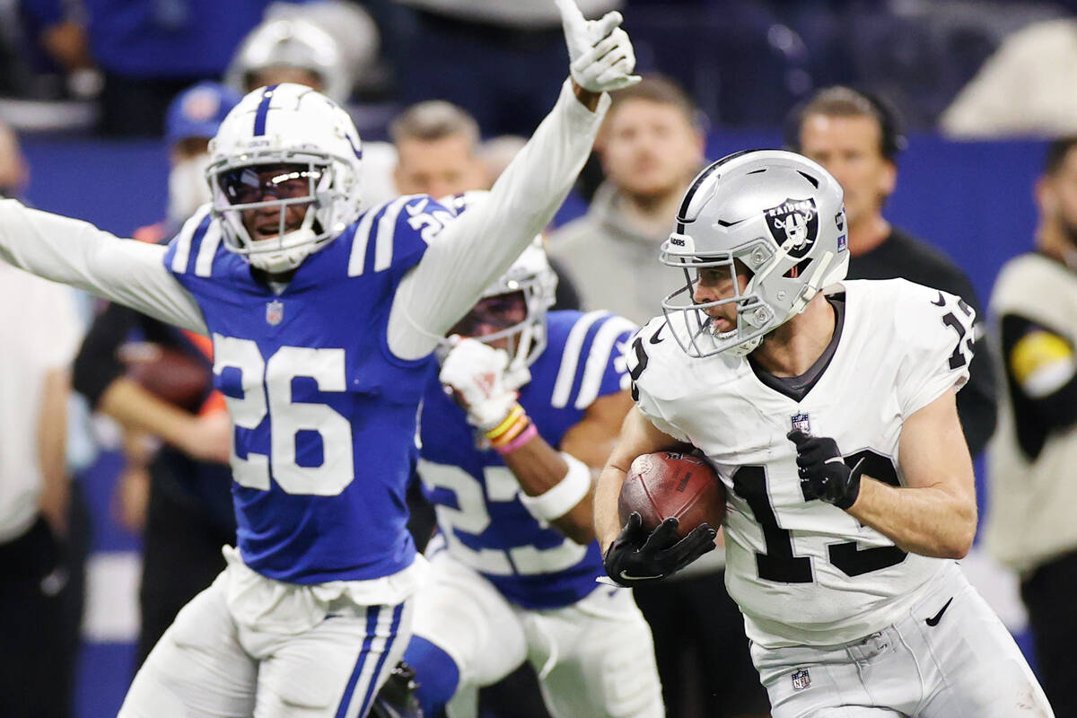 Raiders wide receiver Hunter Renfrow (13) runs leaving behind Indianapolis Colts cornerback Roc ...