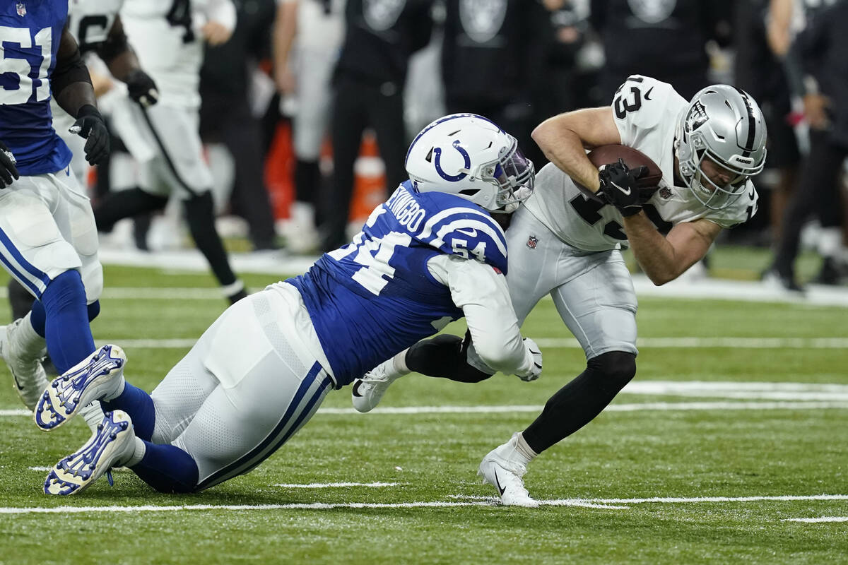 Las Vegas Raiders wide receiver Hunter Renfrow (13) is tackled by Indianapolis Colts defensive ...