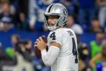 Raiders quarterback Derek Carr (4) prepares to throw during the second half of an NFL football ...