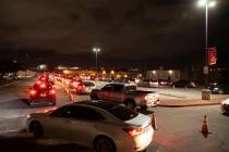 Traffic is backed up for blocks at a drive-thru and walk-up COVID-19 testing site at UNLV Parad ...