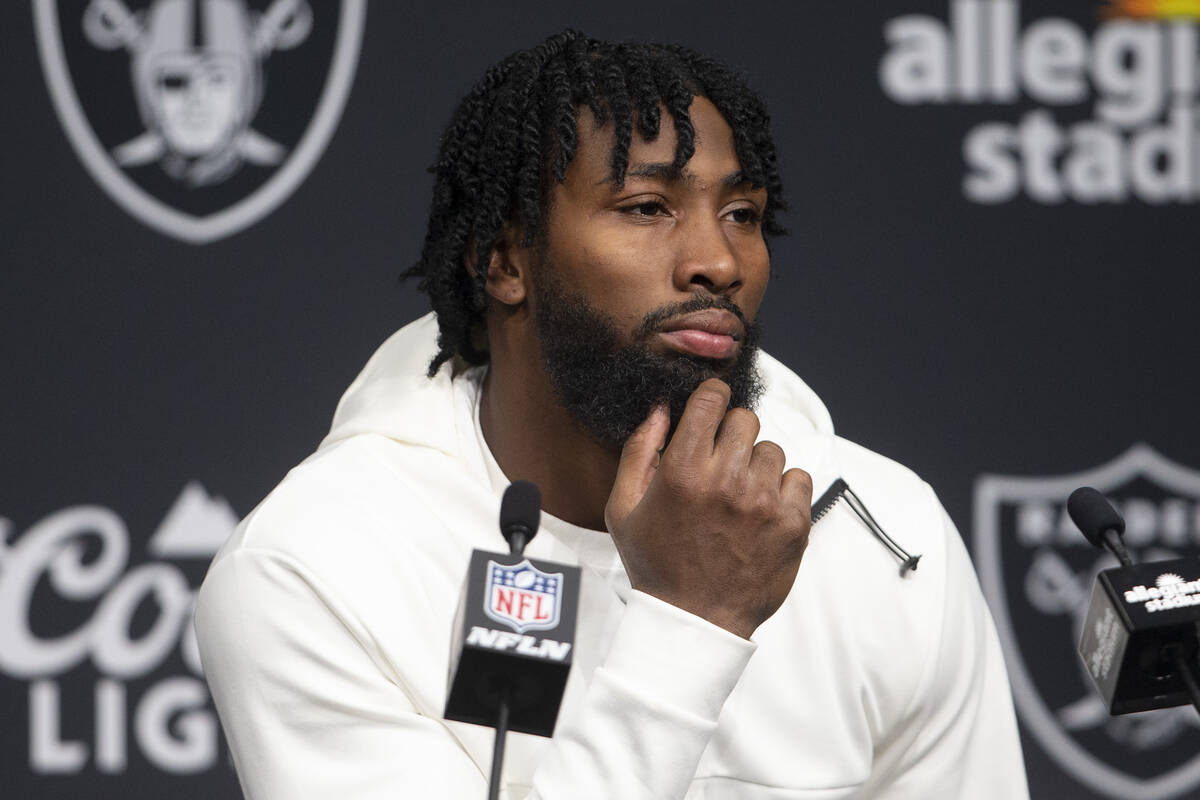 Raiders cornerback Nate Hobbs takes media questions during the post game press conference after ...