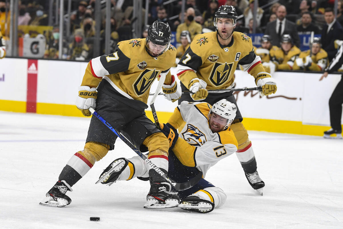 Nashville Predators center Yakov Trenin, hits the ice after tangling with Vegas Golden Knights ...