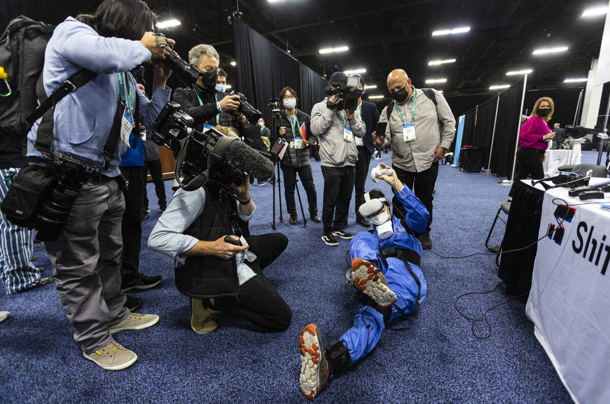 Shiftall CEO Takuma Iwasa demonstrates the HaritoraX full body tracking device, slated to ship ...
