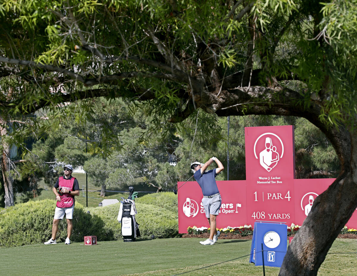 Seamus Power watches his tee shot at the first hole during the Shriners ChildrenÕs Open go ...