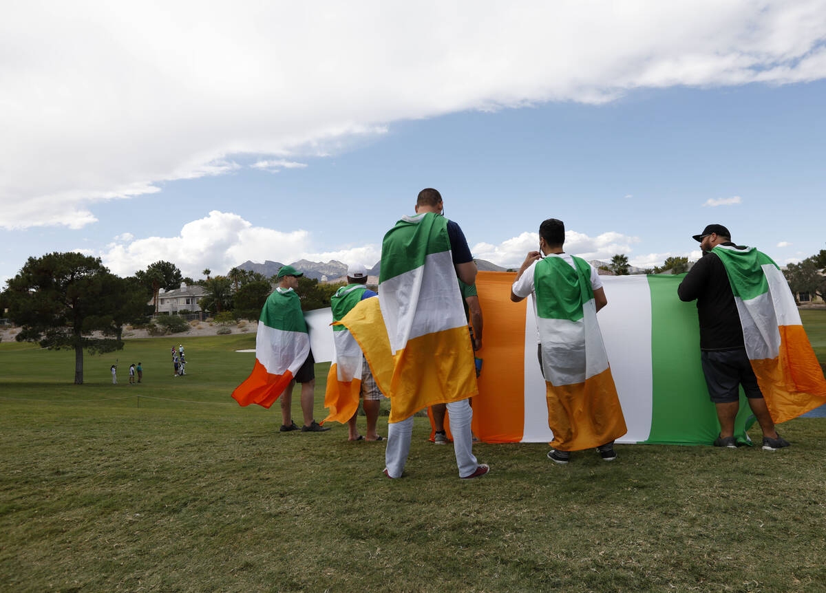 Seamus Power's fans watch his play on the 12th green during the third round of the Shriners Hos ...