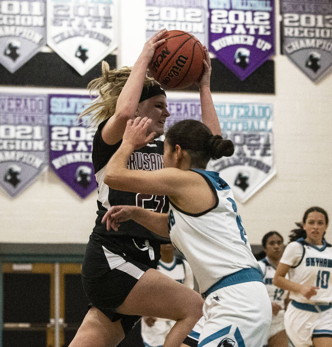 Faith Lutheran HighÕs Raina Forgue (23) shoots implicit    Silverado HighÕs Victoria Leal (1 ...