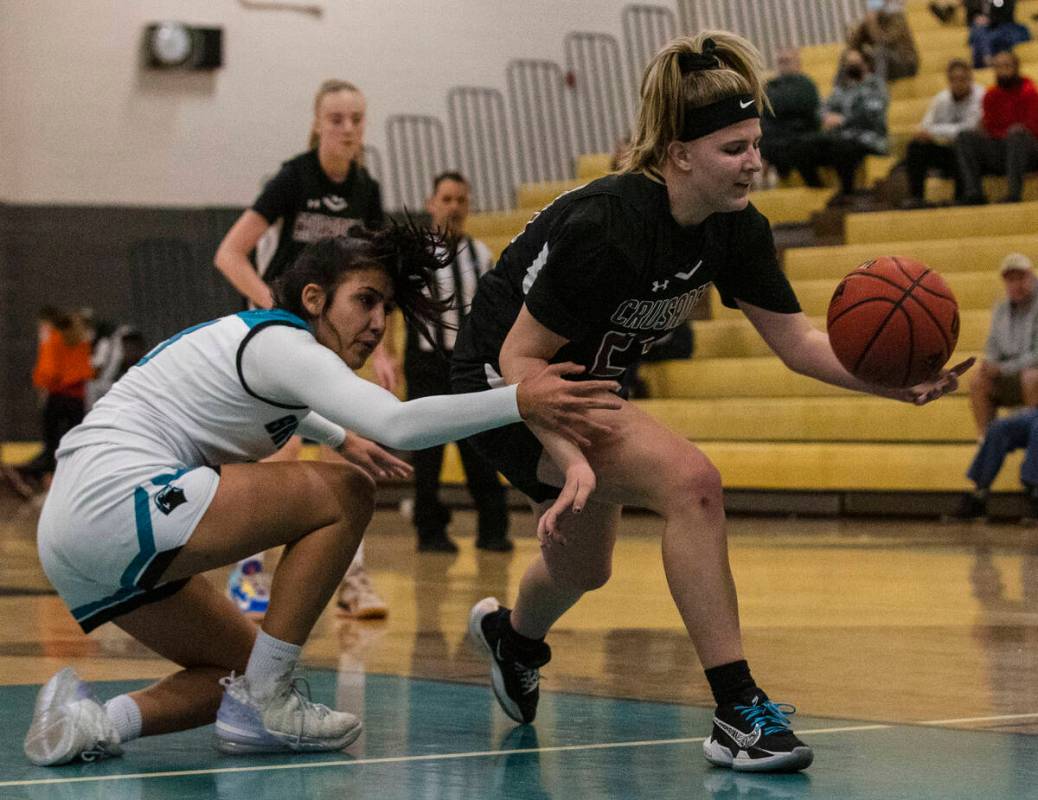 Faith Lutheran HighÕs Raina Forgue (23) drives past Silverado HighÕs Savanna Stokes ( ...