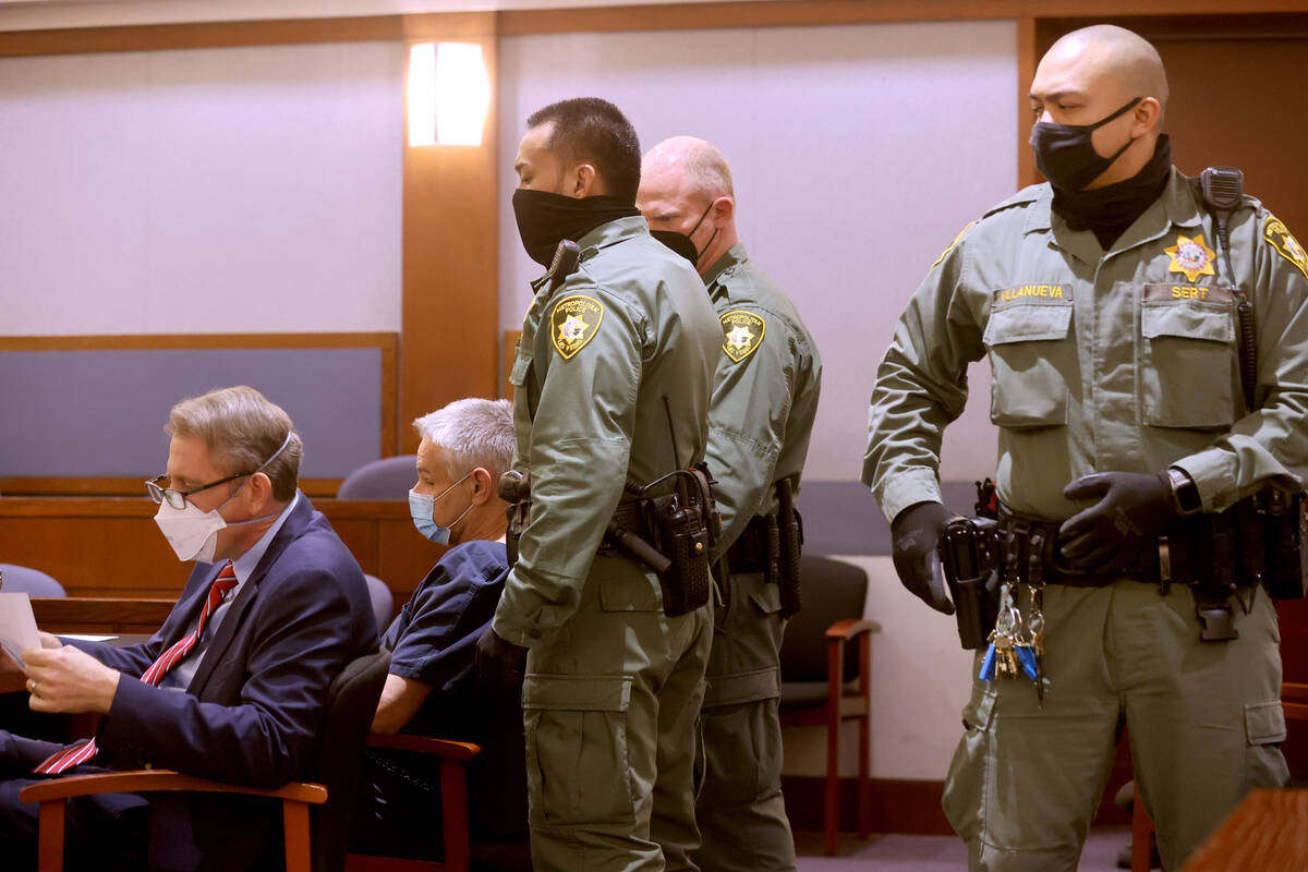 Eric Holland, second from left, appears in court during a bail hearing at the Regional Justice ...