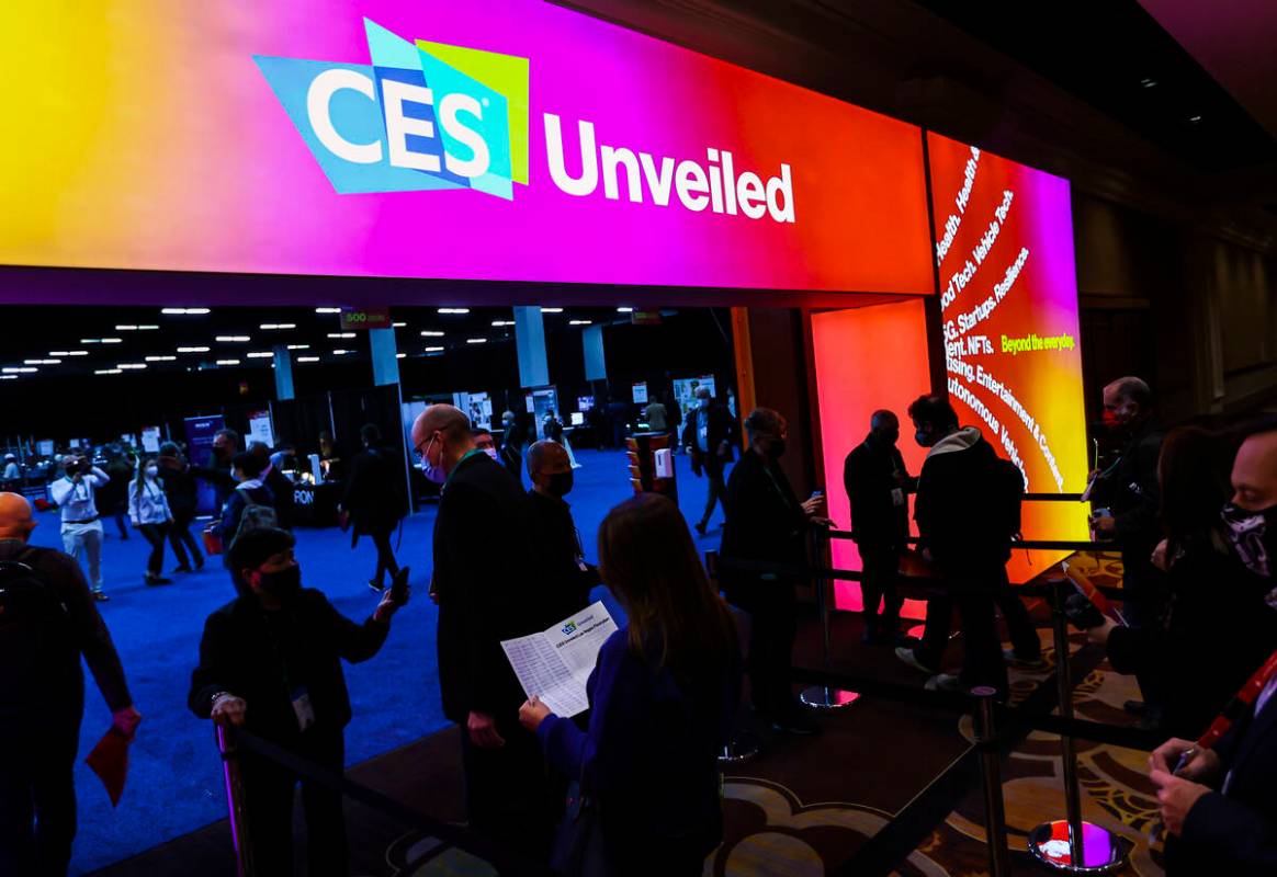 Attendees arrive for the CES Unveiled event at the Mandalay Bay Convention Center Monday, Jan. ...