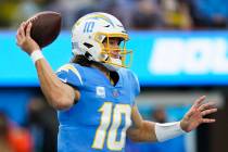 Los Angeles Chargers quarterback Justin Herbert throws a pass during an NFL football game again ...