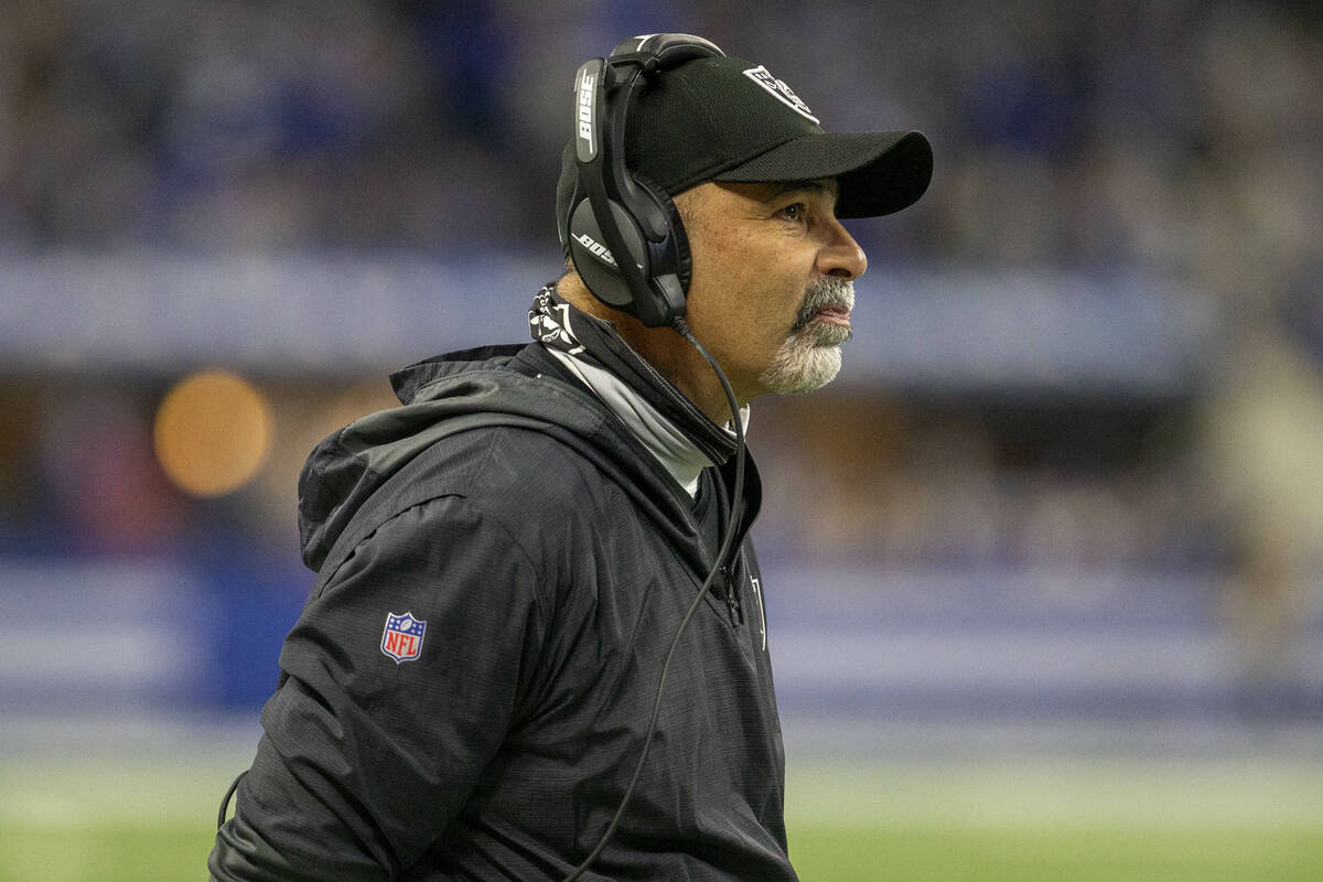 Raiders interim head coach Rich Bisaccia watches the game clock tick down before calling a time ...