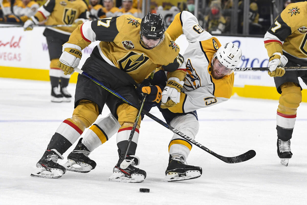 Vegas Golden Knights defenseman Ben Hutton, left, and Nashville Predators center Yakov Trenin b ...