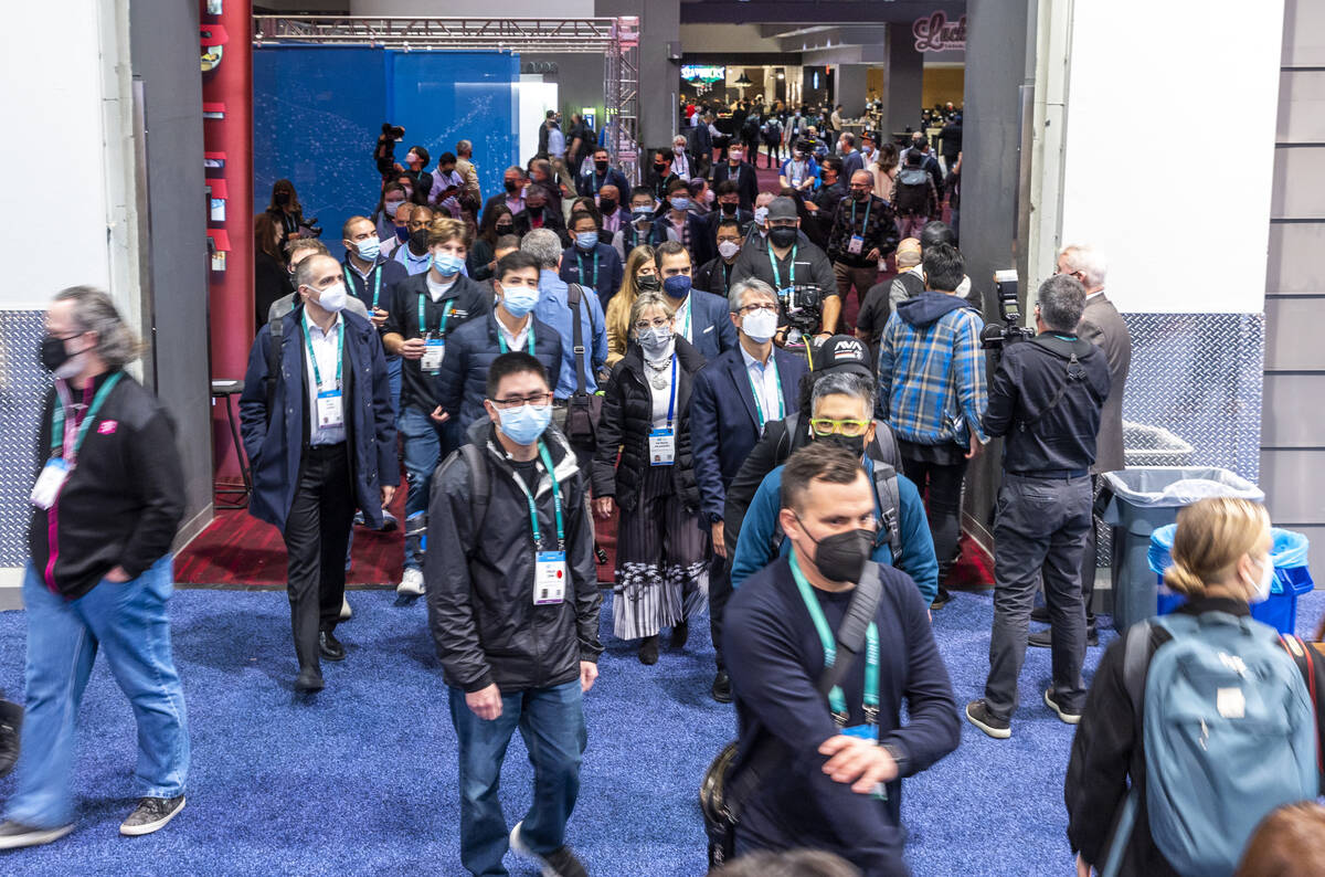 Attendees begin to file into the first day of CES during its opening at the Las Vegas Conventio ...