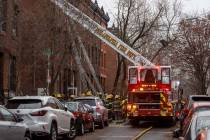 The Philadelphia fire department works at the scene of a deadly row house fire in Philadelphia ...
