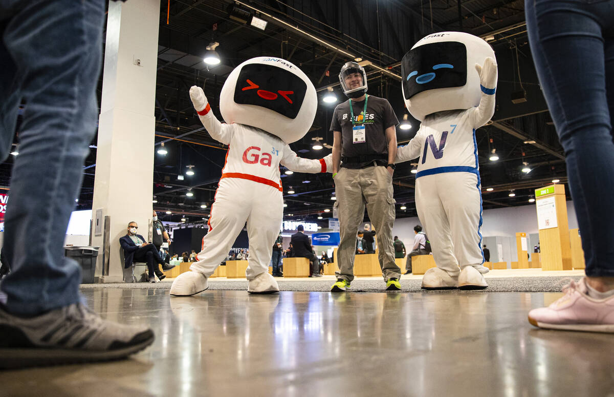 Michael Strickland, of Alpharetta, Ga., poses for a picture with characters representing GaNFas ...