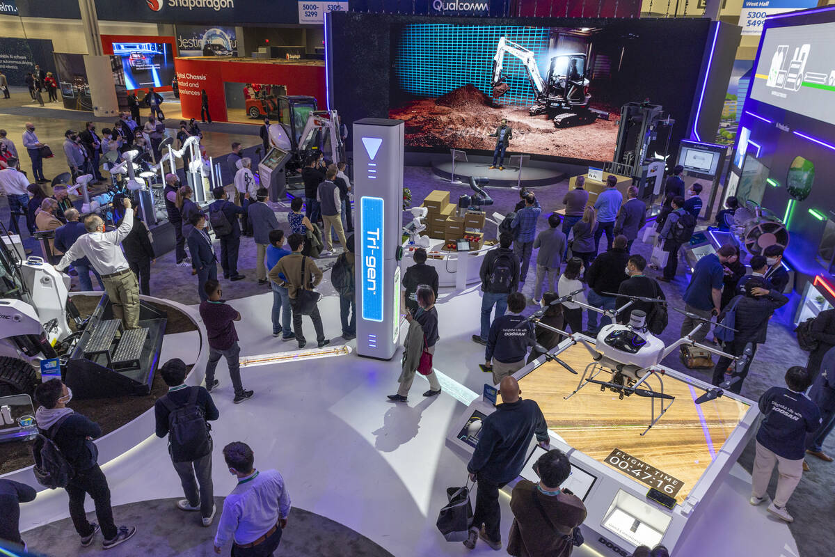 Attendees listen to a talk on the Bobcat E35e electric loader during the first day of CES at th ...