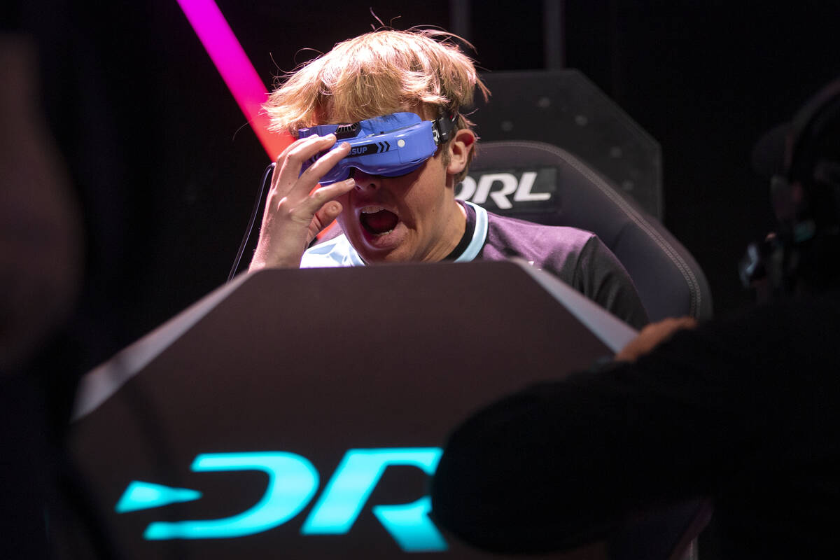 Drone pilot Headsup cheers as he wins a semifinal race during the Drone Racing League Champions ...