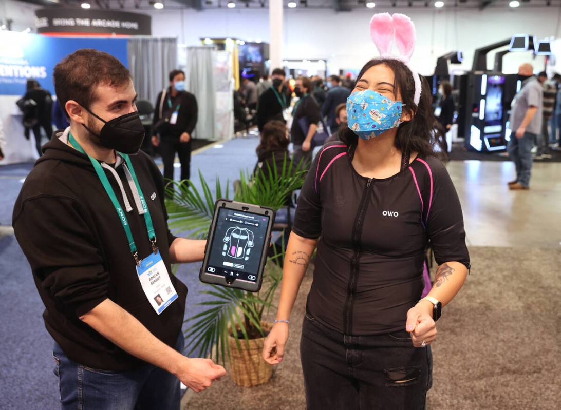 V Bunny of Las Vegas feels arrows being shot at her while wearing the OWO's wireless haptic ves ...