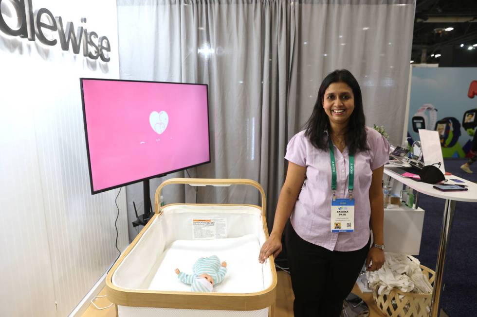 Radhika Patil of San Francisco shows her Cradlewise Smart Crib during the second day of CES at ...