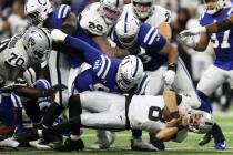 Raiders quarterback Marcus Mariota (8) dives for yardage against the Indianapolis Colts in the ...
