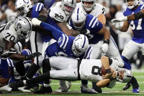 Raiders backmost   Marcus Mariota (8) dives for yardage against the Indianapolis Colts successful  the ...