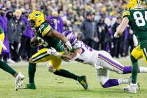 Green Bay Packers running back Aaron Jones (33) runs during an NFL football game against the Mi ...