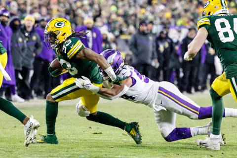 Green Bay Packers moving  backmost  Aaron Jones (33) runs during an NFL shot   crippled  against the Mi ...