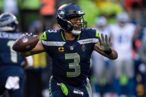 Seattle Seahawks backmost   Russell Wilson drops backmost  to walk  during an NFL shot   crippled  agai ...