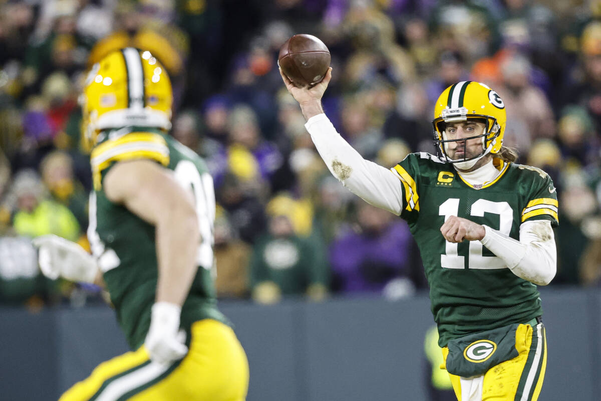 Green Bay Packers quarterback Aaron Rodgers (12) passes the ball during an NFL football game ag ...