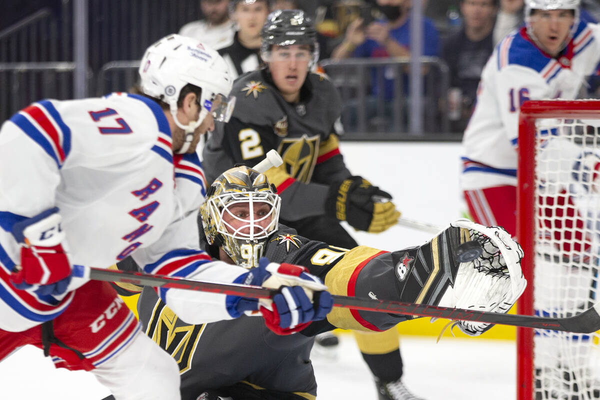 Golden Knights goaltender Robin Lehner (90) saves a shot on goal by Rangers center Kevin Rooney ...