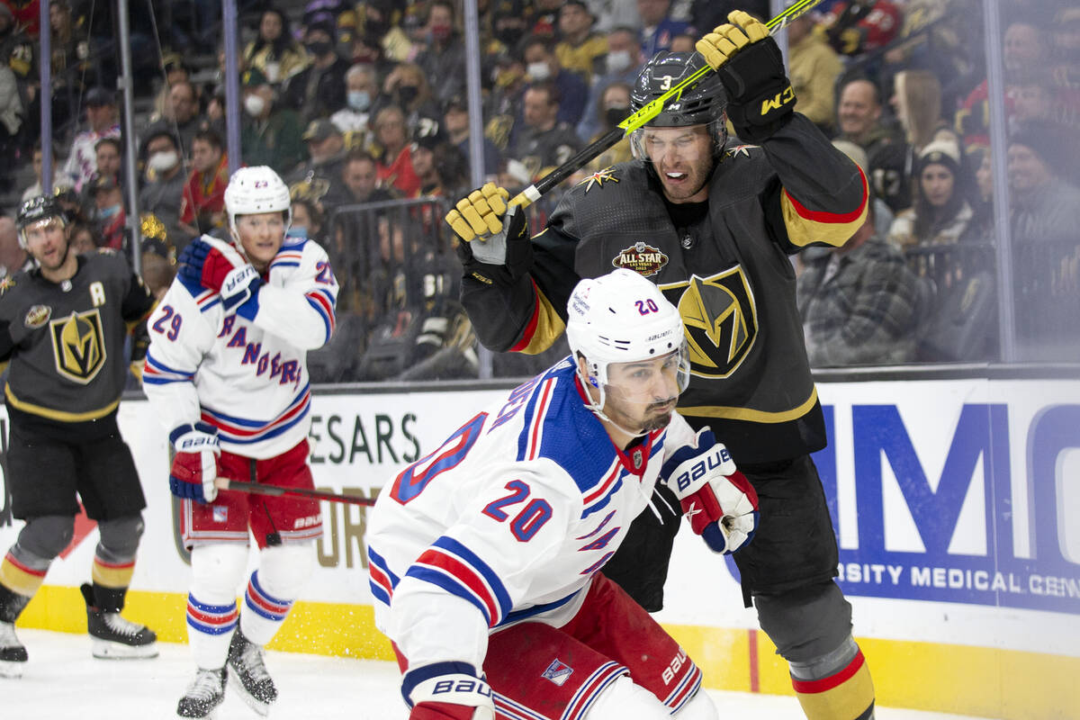 Golden Knights defenseman Brayden McNabb (3) and Rangers left wing Chris Kreider (20) collide w ...