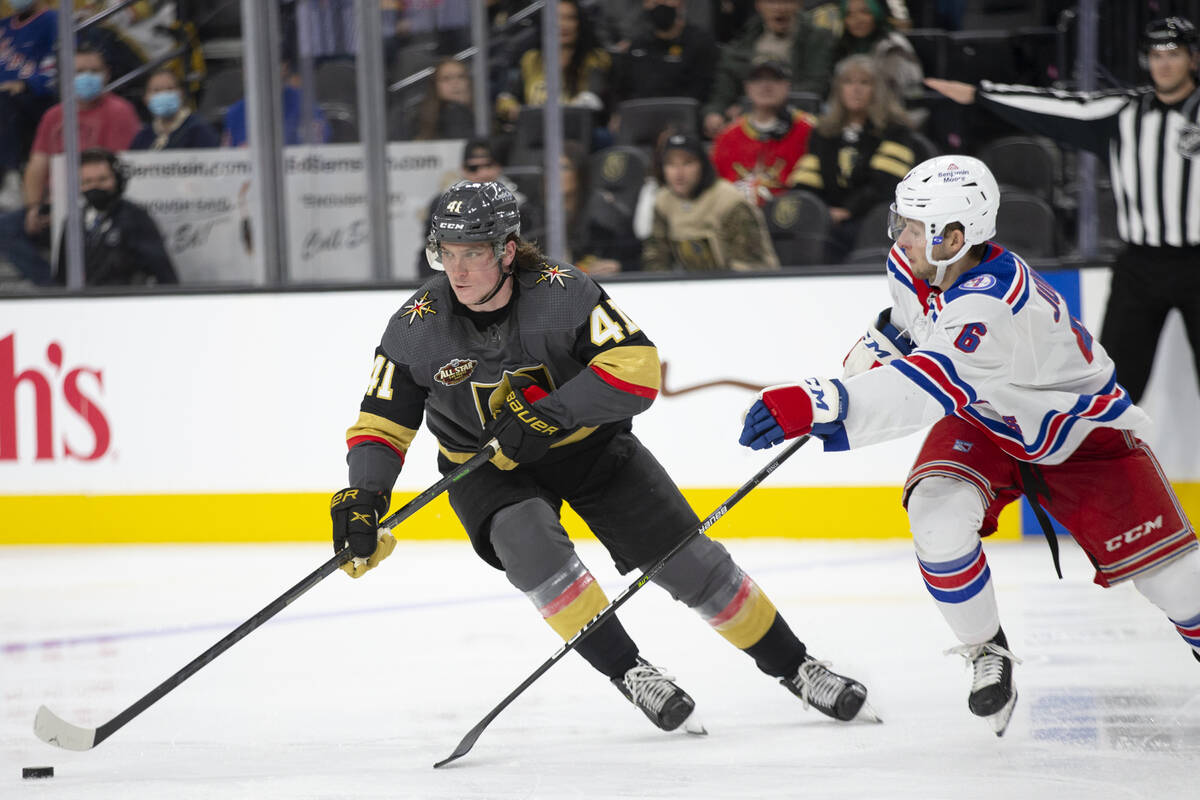 Golden Knights center Nolan Patrick (41) looks to pass while Rangers defenseman Zac Jones (6) s ...