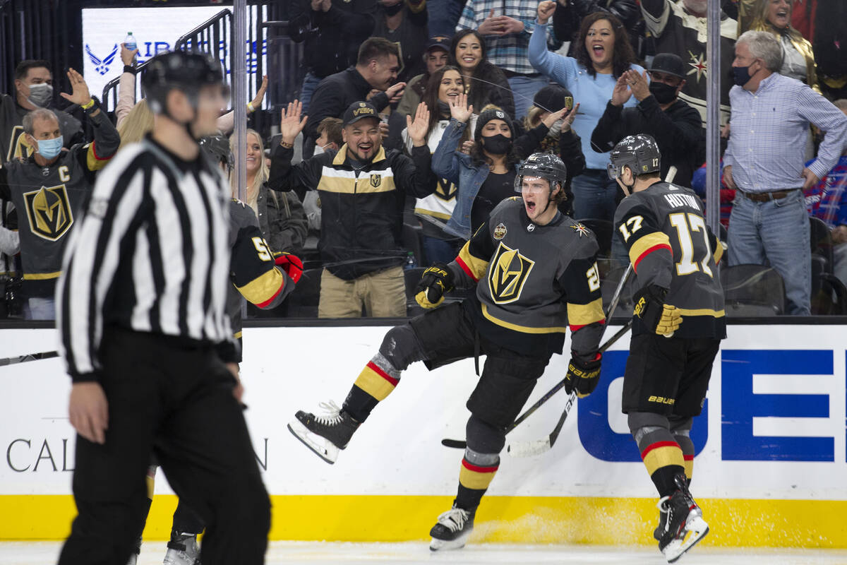 Golden Knights center Brett Howden (21) and defenseman Ben Hutton (17) celebrate after Howden s ...