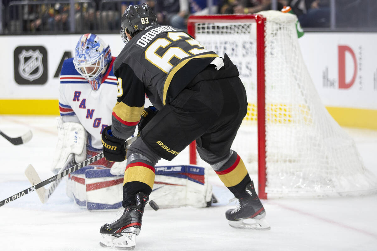 Golden Knights right wing Evgenii Dadonov (63) attempts a goal on Rangers goaltender Alexandar ...