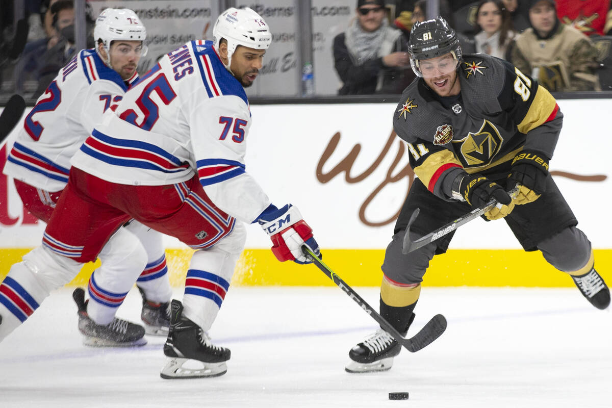 Rangers right wing Ryan Reaves (75) and Golden Knights center Jonathan Marchessault (81) skate ...