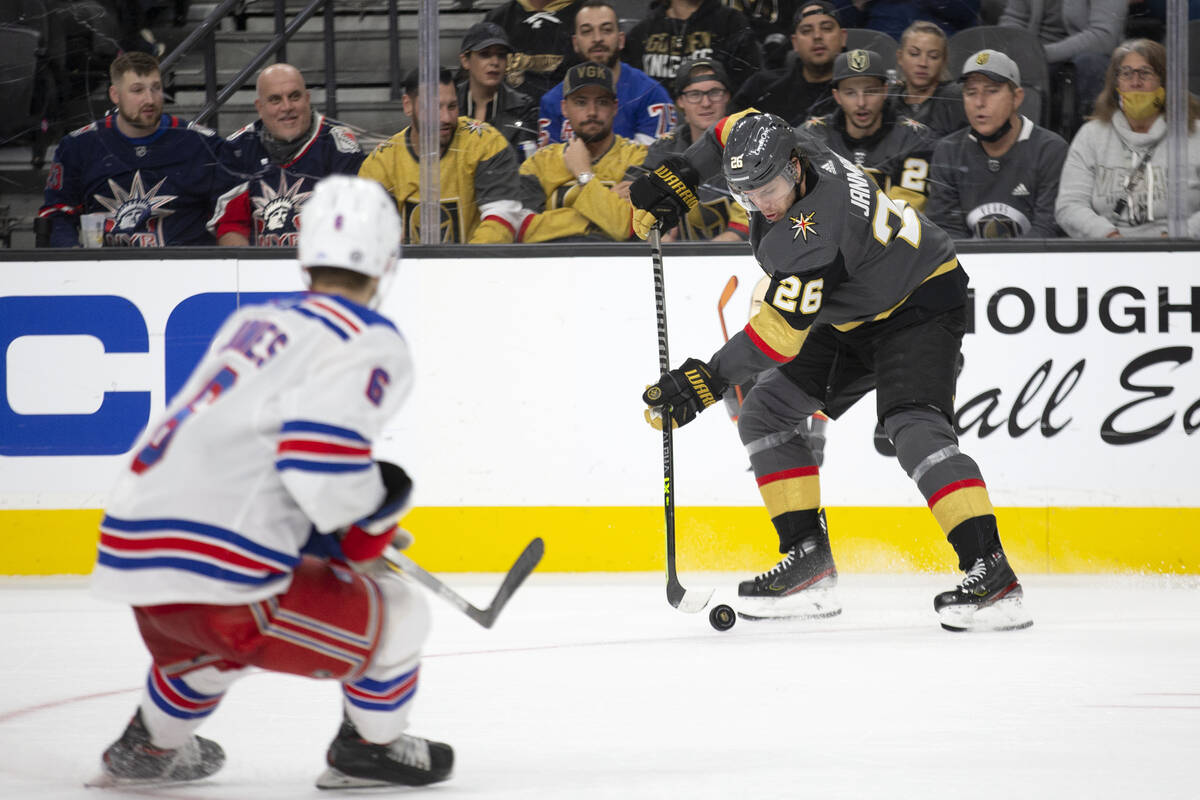 Golden Knights center Mattias Janmark (26) receives a pass while Rangers defenseman Zac Jones ( ...