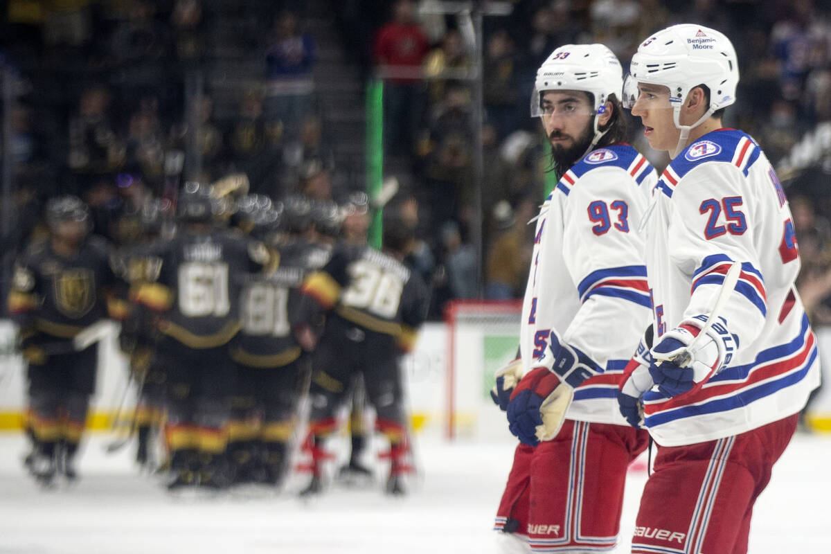 Rangers center Mika Zibanejad (93) and defenseman Libor Hajek (25) skate off the ice as the Gol ...