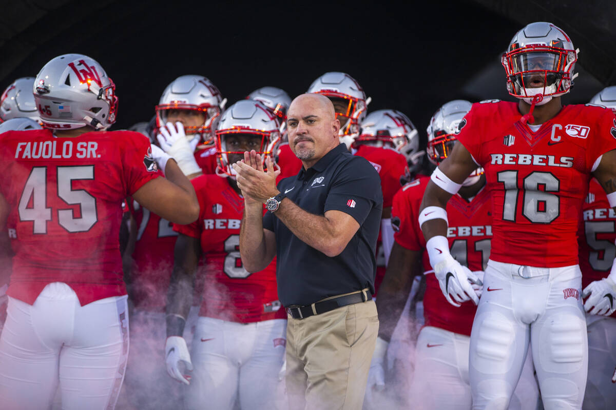 UNLV Head Coach Tony Sanchez waits with his team to take the field versus Southern Utah at Sam ...