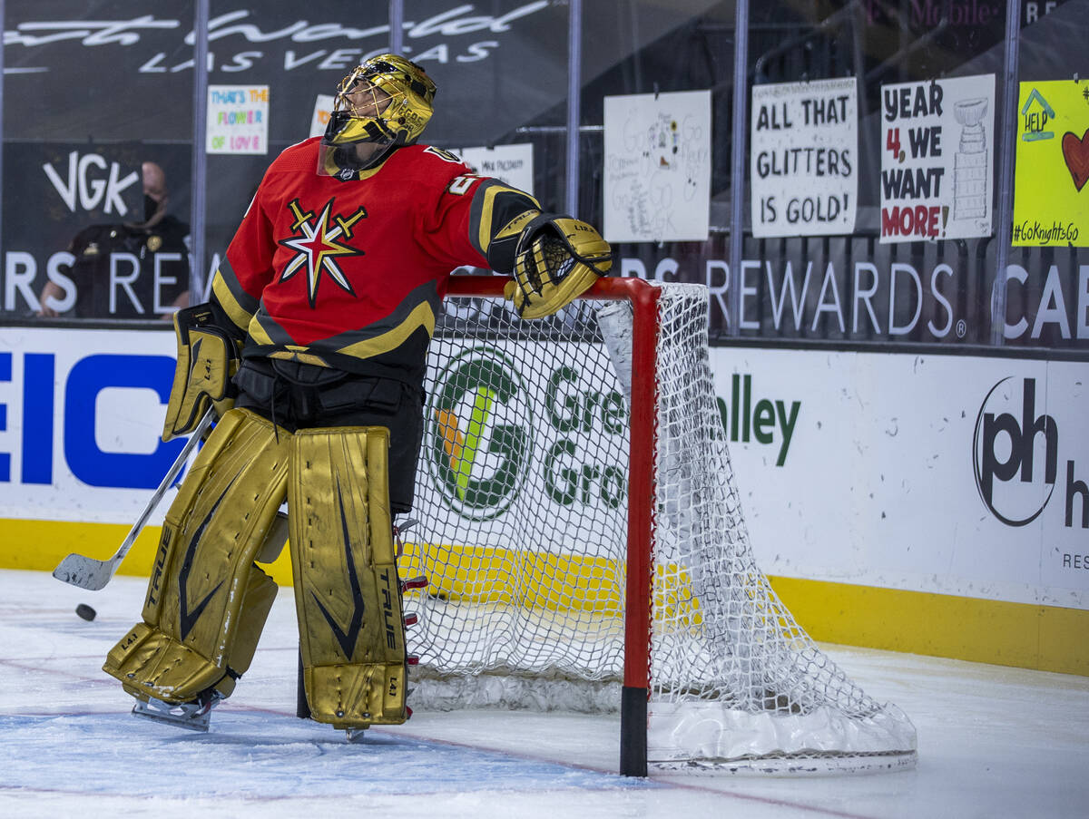Golden Knights goaltender Marc-Andre Fleury (29) looks up to the big screen prior to the first ...