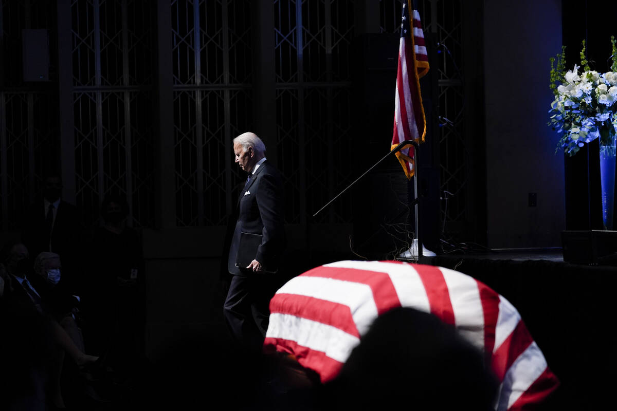 President Joe Biden walks by the flag-draped casket of former Senate Majority Leader Harry Reid ...