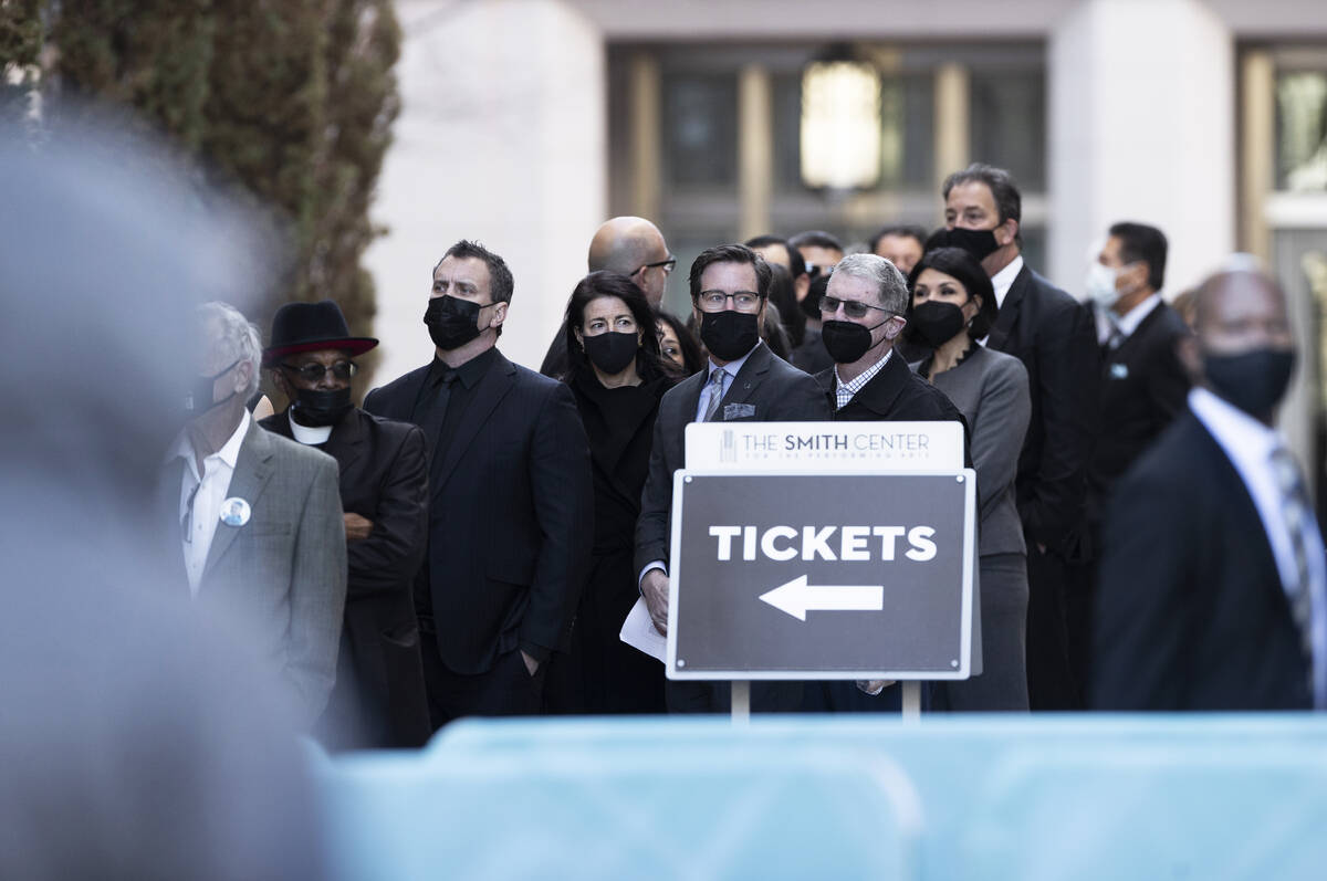 Attendees wait to enter The Smith Center before the start of a memorial service honoring former ...